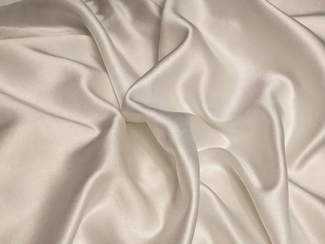 Elegant white silk texture representing premium beauty